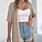Gilet cardigan à manches courtes et motifs ajourés tricoté pour femme