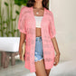 Gilet cardigan à manches courtes et motifs ajourés tricoté pour femme